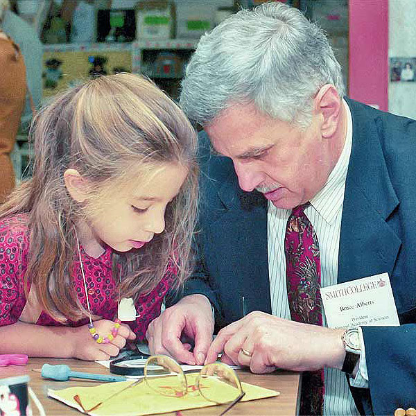 Bruce at Smith College with a little girl.