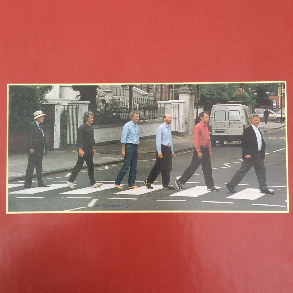 Authors of MBoC imitating the famous Abbey Road cover.