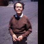 Barbara McClintock at the train station at Cold Spring Harbor, seeing her friend Bruce off, late 1980s.